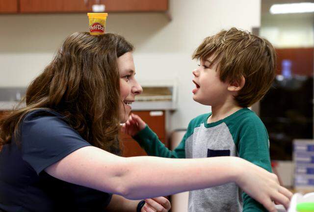 Student clinician Kathryn Jones interacts with Phoenix, 3, during a early communication, language and social skills program clinical on Thursday, March 5, 2026, at the Callier Center in Dallas. The Callier Center offers many different programs for children with communication disorders.